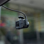 Garmin Dash Cam X110 installed rear view showing compact windshield mounting
